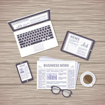 News concept. Daily information from different resources on the screens of devices and in the paper. News on laptop, tablet, phone, newspaper with coffee and glasses on a wooden desk. View from above