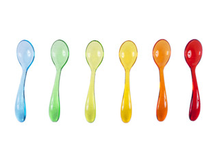 Colorful baby spoon set on white isolated background