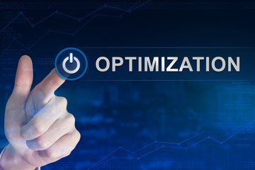 business hand clicking optimization button