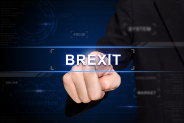 business hand pushing brexit or british exit button on virtual screen