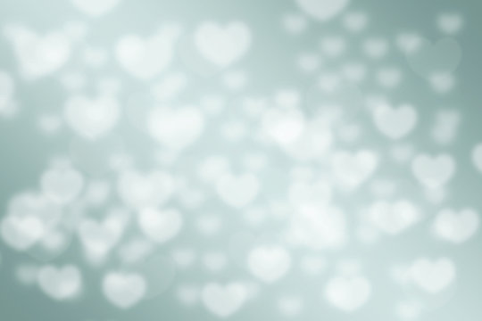 green pastel love hearts bokeh blurred background