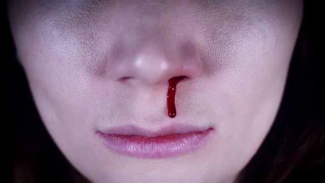 4K Horror Close-Up of Woman Nose Bleeding
