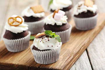 Chocolate cupcakes on a grey wooden table