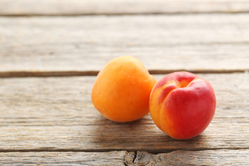 Ripe apricots fruit on grey wooden table