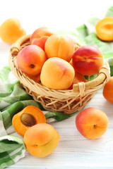 Ripe apricots fruit on white wooden table