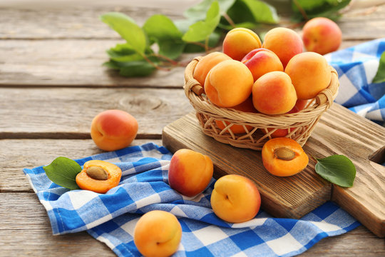 Ripe apricots fruit on grey wooden table