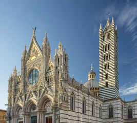 view to cathedral and towers in Siena in Tuscany in Italy