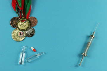 Concept of doping in sport - deprivation medals. Place for your text.