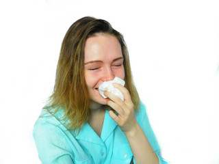 An emotional girl is wiping her nose with a handkerchief