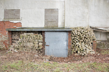 Iron Metal door in Backyard garden bunker to save live