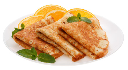 Serving pancakes with orange slices on the plate.