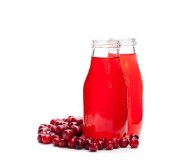 Organic  cranberry juice in bottles with berries isolated on white background