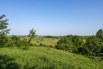 Fototapeta na wymiar Reservoirs and field shelterbelts in the fields near the village of Novoselivka in the Novo-vodolaz'ke district, Kharkiv region of Ukraine. 2007