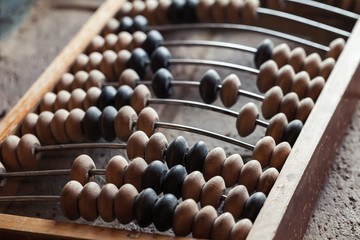 Vintage abacus lay on stone table