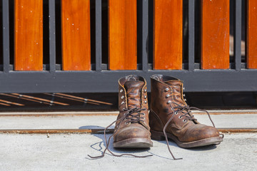 old worn boots on floor