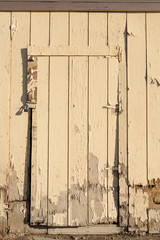 old wooden door with paint peeling off..