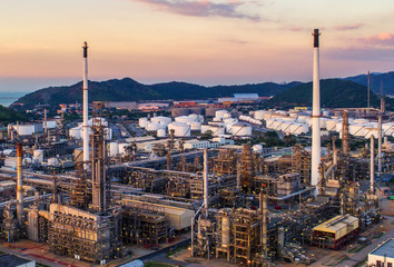 Oil refinery with a background of the city.The factory is located in the middle of nature 