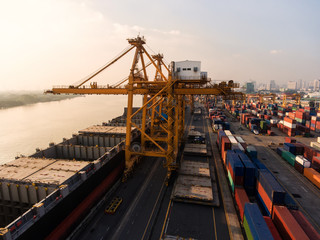 container ship in import export and business logistic.By crane ,Trade Port , Shipping.cargo to harbor.Aerial view.Top view.