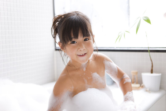 Girl taking a bubble bath