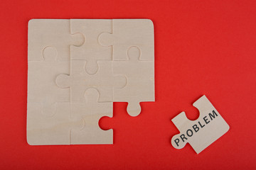 Jigsaw Puzzle Pieces with word "Problem" on wooden background