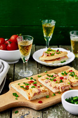 Delicious italian pizza with salami, peppers and tomatoes