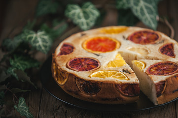 home made citrus cake on wooden table in rustic style