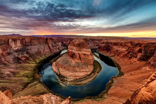 Wide view of Horseshoe bend  near the town of Page, Arizona at sunset.