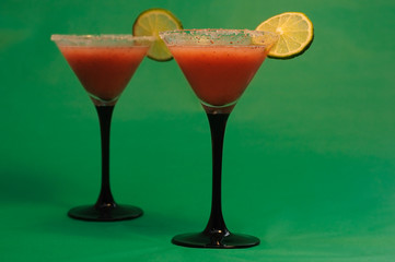 Strawberry cocktail against green background