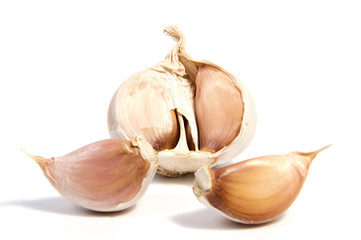 Fresh organic garlic and cutted garlic clove isolated on white background