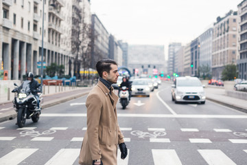 Beautiful young man posing in an urban context