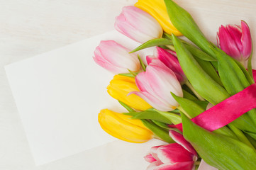 Bouquet of tulips  and blank greeting card