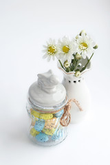 Still life with white flowers Chrysanthemums in vase and easter decor close up on abstract light background. festive easter composition