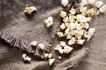 Homemade Kettle Corn Popcorn on wooden background -  cinema, movies and entertainment concept