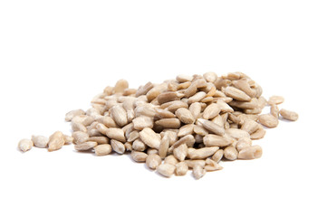 peeled sunflower seeds on white surface. isolated