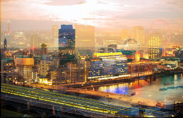 Fototapeta premium City of London at night. Multiple exposure image includes City of London financial aria, London eye, River Thames at sunset