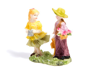 The statue of lovers boy and girl isolated on white background