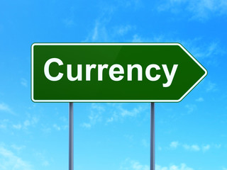 Money concept: Currency on road sign background