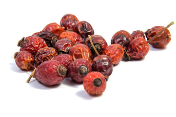dried rose hips isolated on white background