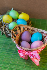 Fototapeta na wymiar Easter eggs on the green background