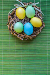Easter eggs on the green background