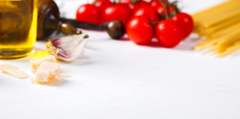 Pasta Spaghetti with ingredients for cooking pasta on a white background.Copy space for Text. selective focus.
