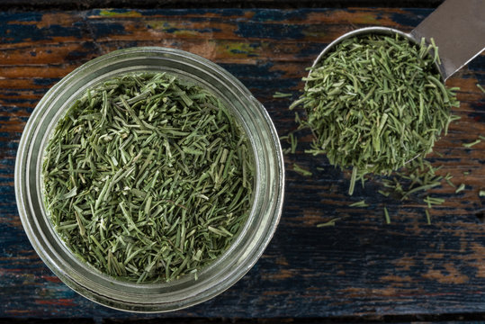 Dill Weed in a Spice Jar with a Teaspoon