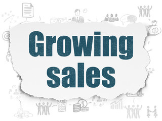 Finance concept: Growing Sales on Torn Paper background