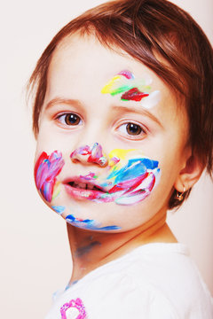 portrait of a beautiful baby girl model with color art makeup