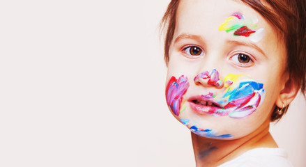 portrait of a beautiful baby girl model with color art makeup