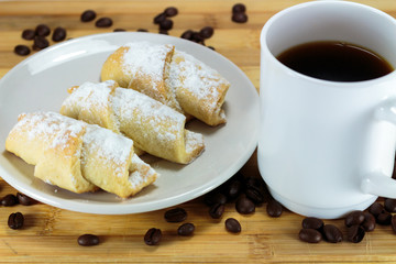 One cup of coffee and pie cake with coffee beans.