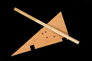 Scraps of plywood on a black background
