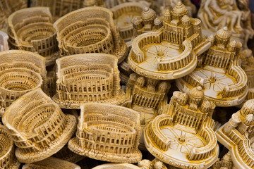 models of sights (colosseum, st. peter's square) at souvenir stall in rome