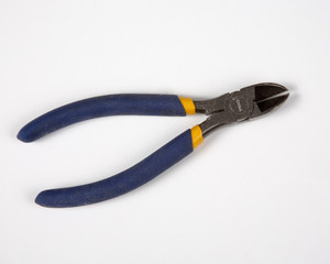 Blue side cutter pliers on a white background