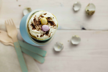 Easter cupcakes with colorful chocolate eggs.